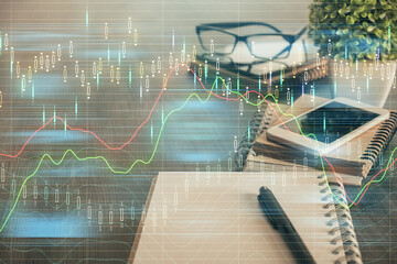 Double exposure of forex chart drawing and cell phone background. Concept of financial trading
