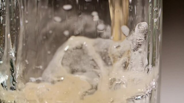pouring beer into a glass