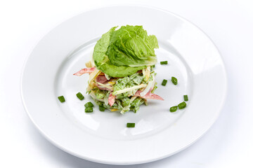 fresh vegetarian salad on the white plate