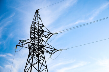 High voltage tower against beautiful blue sky
