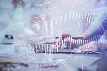 Multi exposure of woman hands typing on computer and financial chart hologram drawing. Stock market analysis concept.