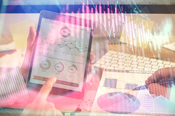 Multi exposure of man's hands holding and using a phone and financial chart drawing. Market analysis concept.