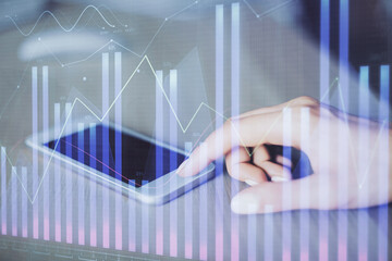 Double exposure of forex chart sketch hologram and woman holding and using a mobile device. Financial market concept.