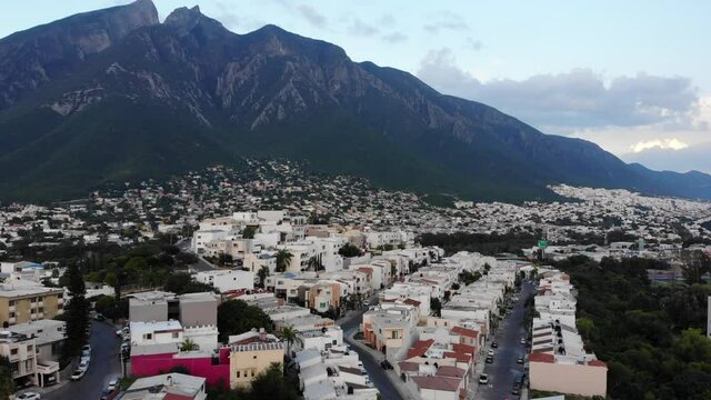 Aerial shot of a house in Monterrey with Cerro de la Silla in the background