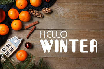 Hello Winter greeting card. Flat lay composition with tangerines on wooden background - Powered by Adobe