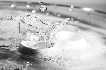 Splash of saline water in contact lens container