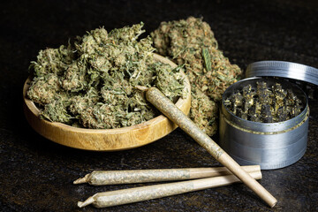 Wooden Bowl of Marijuana with Grinder and joints
