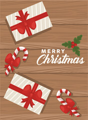 Fototapeta na wymiar merry christmas lettering with gifts and canes in wooden background