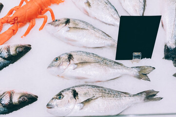 Fish with ice in the refrigerator in the supermarket.