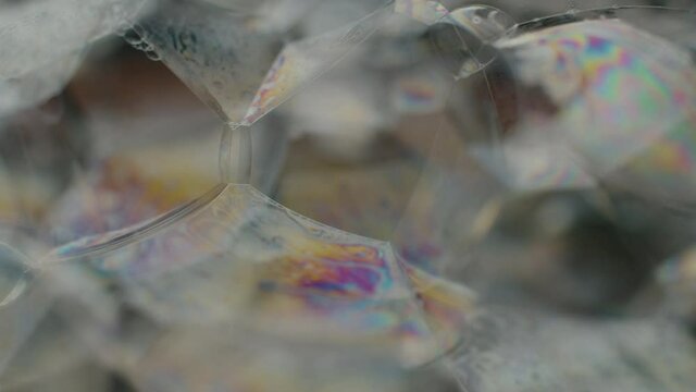 Super macro foam with bubbles popping. Abstract background
