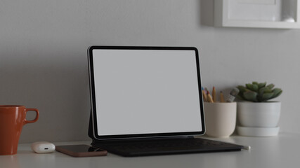 Workspace with nock up blank screen tablet with office supplies, clipping path
