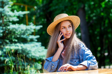 Portrait of a young model in a straw hat