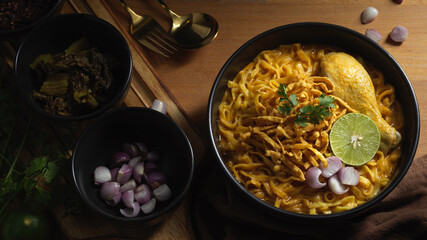 Northern Thai food, Noodles curry soup with Chicken (Khao Soi) served with side dish