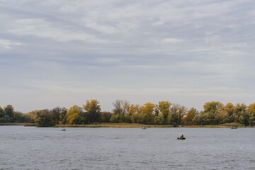 Fall landscape with the river and the forest on a another coast.