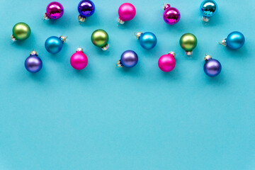 Christmas or new year multicolored balls on a blue background. Space for text