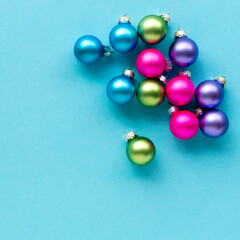 Christmas or new year multicolored balls on a blue background, top view
