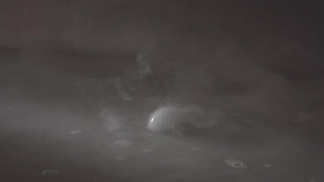 Smoke gas bubbles made with dry ice pop in the air, visual texture effect