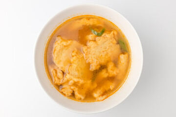 Fish cake soup on a white background