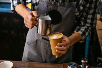 Fototapeta na wymiar Barista making hot coffee in cafe