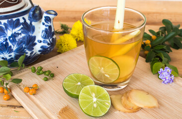 herbal healthy drinks mix ginger ,lemon ,honey ,lemongrass for sore throat with teapot on...