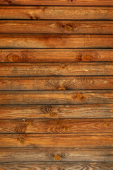 Fototapeta premium the texture of an old wooden Board. The wall of an old house, sheathed in boards.