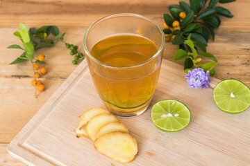 herbal healthy drinks mix ginger ,lemon ,honey  for sore throat on background wooden