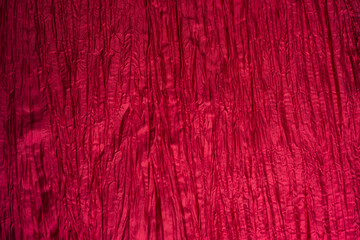  Red wrinkled taffeta background. Crumpled texture.