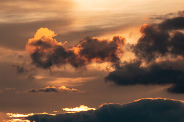clouds with black clouds at sunset as background