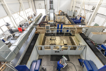 large CNC metal milling machine in the interior of a Metalworking plant. - obrazy, fototapety, plakaty