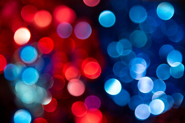 Festive blurry bokeh background of red and blue lights