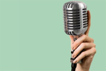 Retro style classic microphone on background