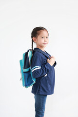 Portrait asian little kid girl in casual school uniform with backpack on white background. Studio shot