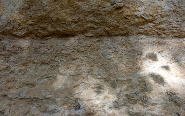 Natural mountain stone,a section of rock texture on a Sunny day.