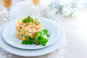 New Years festive salad with red fish on a white plate, horizontal, place for text