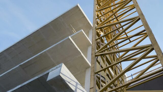 The yellow crane beside the underconstruction building in Estonia