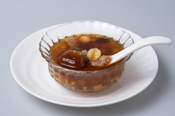 Sweet dessert: kind of Chinese dessert with boil sugar syrup is delicious here are many grains, including green beans, lotus seeds, millet, persimmon, jelly, longan,