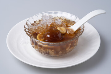 Sweet dessert: kind of Chinese dessert with boil sugar syrup is delicious here are many grains, including green beans, lotus seeds, millet, persimmon, jelly, longan,
