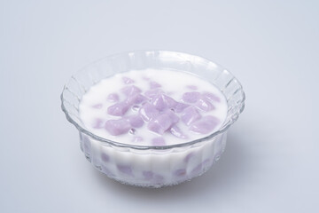 Thai dessert, Taro in sweet coconut milk isolated on white background