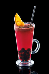 Glass of black currant and orange hot tea