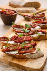 Toasts with goat cheese and dried tomato