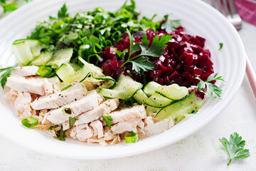 Trendy salad. Chicken boiled fillet with salad beetroot and cucumber. Healthy food, ketogenic diet, diet lunch concept. Keto/Paleo diet menu.