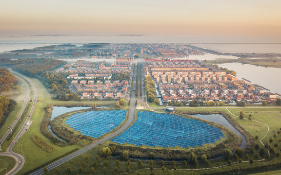 Sustainable neighbourhood in Netherlands powered by solar panels, aerial view