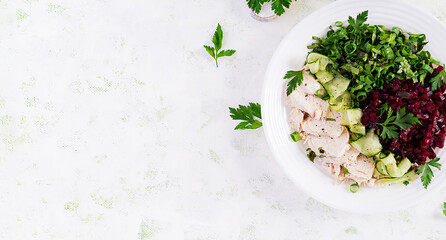 Trendy salad. Chicken boiled fillet with salad beetroot and cucumber. Healthy food, ketogenic diet,...