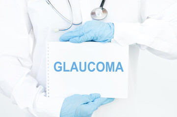 Doctor holding a card with text Glaucoma medical concept