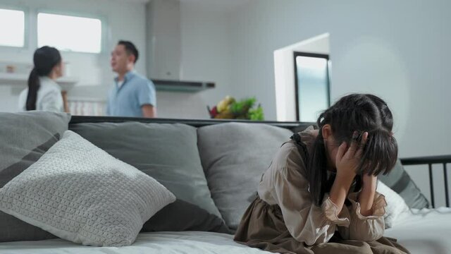 Asian young girl feeling sad to see family fighting, Domestic violence