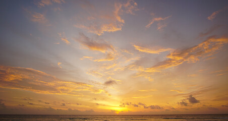 Nature background. Shot of Landscape amazing of red sky sunset in the sea with red clouds background. Travel concept.