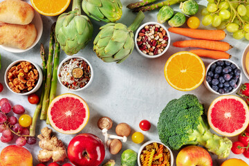 Vegan food background, a flat lay with fruit and vegetables, shot from the top with a place for text. Healthy food concept