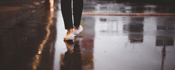 Woman travel in the downtown while raining in rush hour