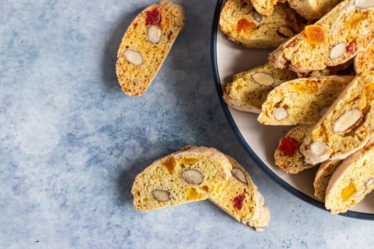 Traditional Italian cookies biscotti, cantucci or cantuccini with almond and dry fruits. Top view.