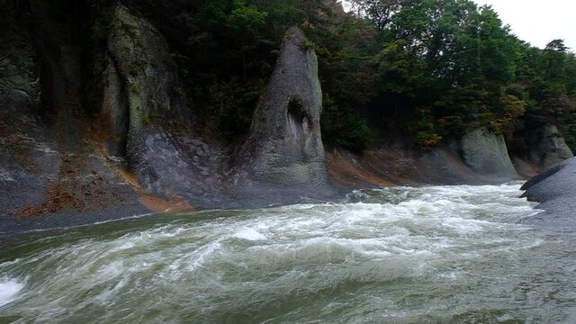 A slow motion of a large water stream that flows noisily in a huge rocky environment, Fukiware Falls is often called "Japan's version of Niagara Falls", next to Numata, near Nikko National Park, Japan